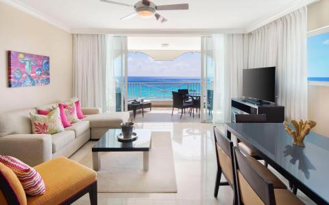 This image features a beautifully appointed living room in a coastal vacation property