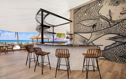 This image shows an outdoor bar setup at a beachside location