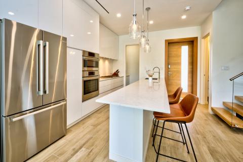 Sleek Modern Kitchen with Stainless Steel Appliances and Marble Island