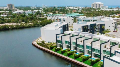 Contemporary Waterfront Housing Development with Tropical Surroundings