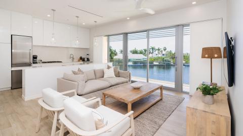 Modern Open-Plan Living Room and Kitchen with Tranquil Water View