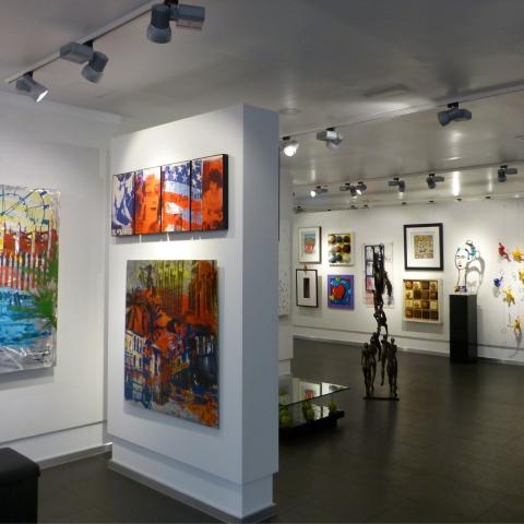 The image depicts the interior of an art gallery