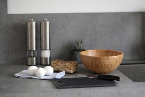 This image features a kitchen countertop setup that includes various items
