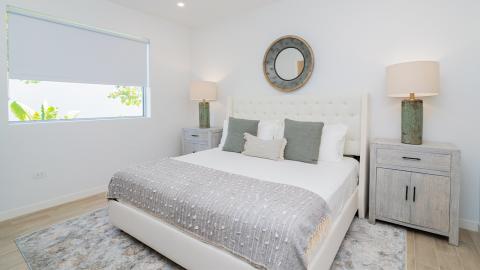 The image shows a stylish and modern bedroom