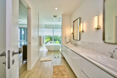 Bright Modern Bathroom with Free-Standing Tub and Marble Vanity