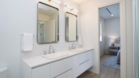 Sleek and Minimalistic Modern Bathroom in Suite Setting