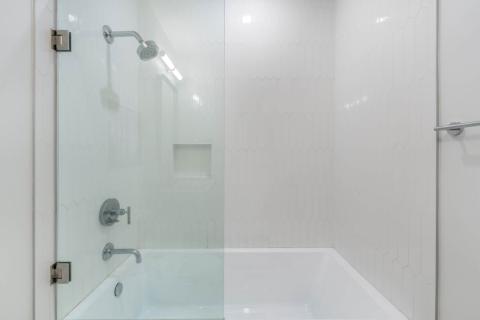 ONE Canal Point: Modern Bathroom with Sleek Shower and Bathtub Combo