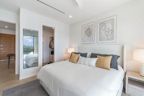 ONE Canal Point: Bright Modern Bedroom with Abstract Art and Neutral Tones