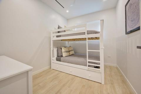 Modern bedroom with white bunk bed