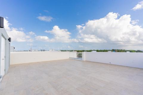 Spacious modern rooftop terrace with tiled flooring