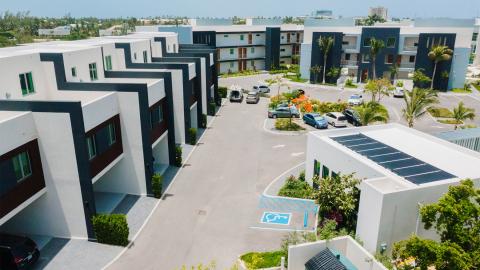 Modern housing complex with multi-storey buildings and central courtyard