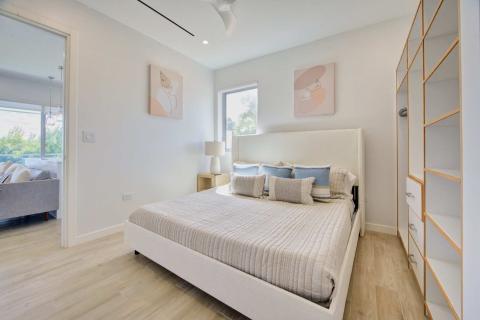 Modern bedroom with white headboard