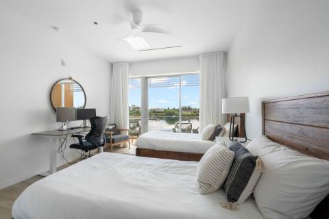 ONE Canal Point: Modern Bedroom with Scenic Views and Workspace