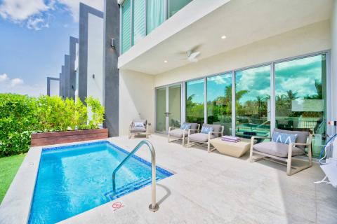 The image shows a modern, luxury backyard setting