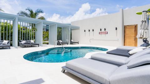 Luxurious Outdoor Swimming Area with Round Pool and Sun Loungers