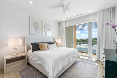 ONE Canal Point: A Modern and Well-Decorated Bedroom with Scenic Views