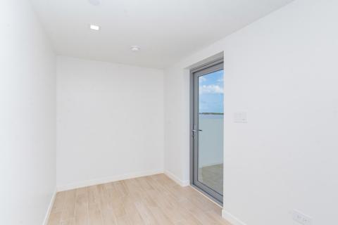 Serene Minimalist Room with Glass Door and Natural Light