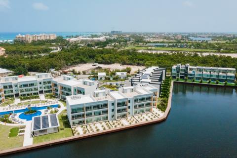 This image shows a luxurious residential area featuring modern, multi-storey buildings