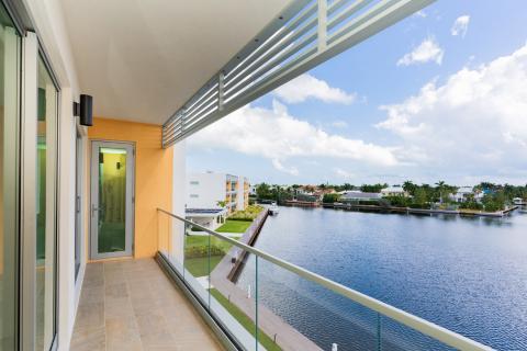 Serene View from Modern Residential Balcony Overlooking Waterway