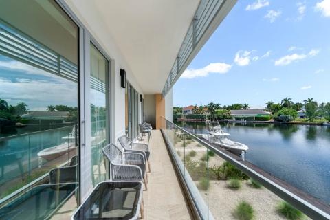 ONE Canal Point: Luxurious Balcony Overlooking a Scenic Canal