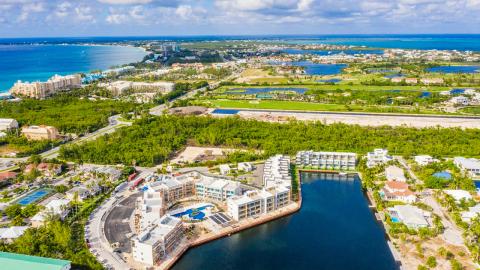 One Canal Point: Aerial view of coastal area with marina, resorts, and residential properties