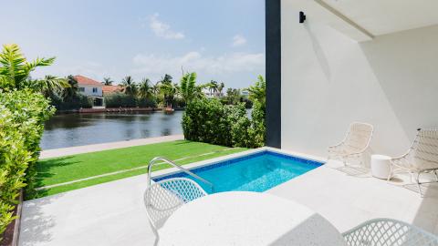 Luxurious Outdoor Area with Swimming Pool and Tranquil River View