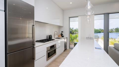 Sleek Modern Kitchen with Waterfront View and Bosch Appliances