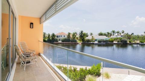 Tranquil Waterway View from Modern Balcony in Luxurious Residential Are