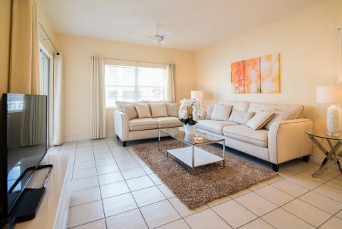 Modern beige living room setup.