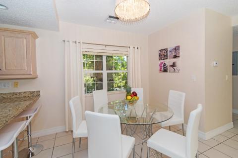 Modern dining area with chandelier.  