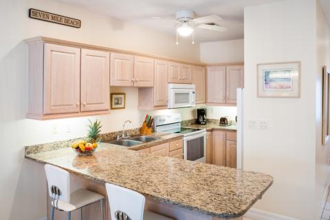 Organized kitchen with white stools