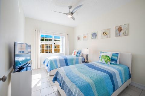 Coastal twin beds with decor  