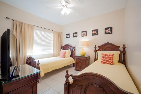  Twin beds with yellow bedcovers