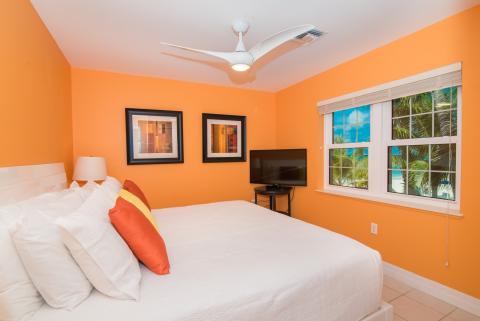 Bright orange walls bedroom