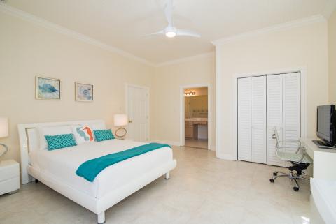  Neatly arranged bedroom with bed  