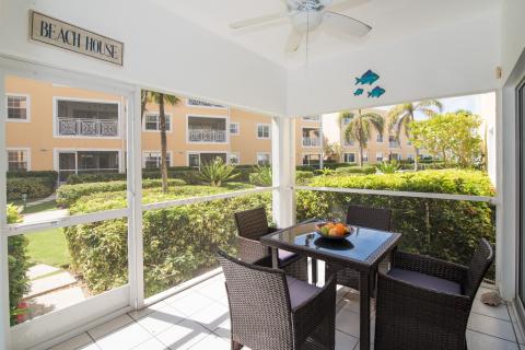  Screened porch with wicker furniture