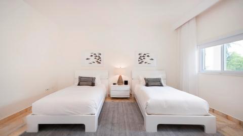 Modern twin bedroom with accents