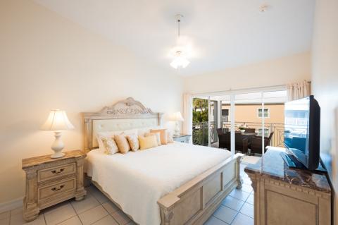 Elegant well-furnished bedroom with balcony