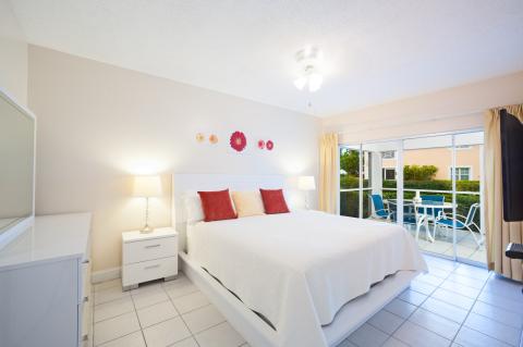   Well-appointed bedroom leading to an outdoor terrace