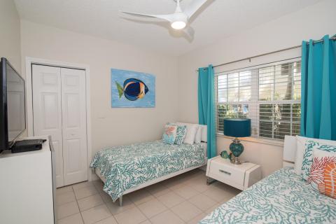 Coastal themed bedroom with beds  