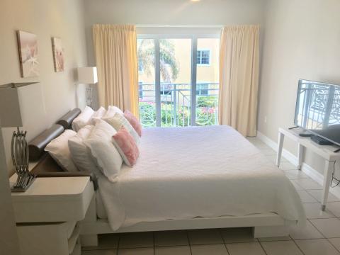  Neatly arranged bedroom with bed