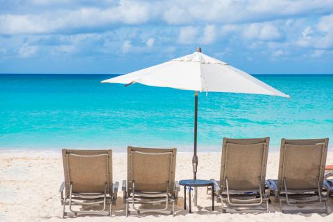 Lounging chairs on serene beach