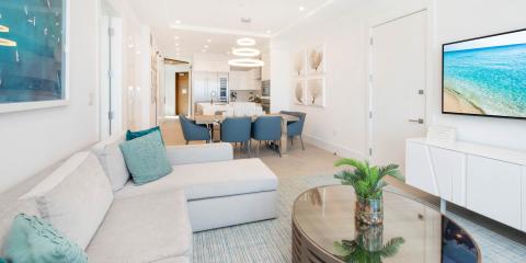 The image displays a modern, open-plan living and dining area in a home