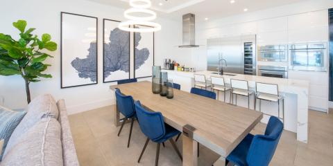 This image features a modern dining and kitchen area