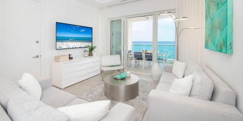 This image displays a modern living room with a coastal theme