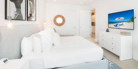 The image displays a well-decorated modern bedroom
