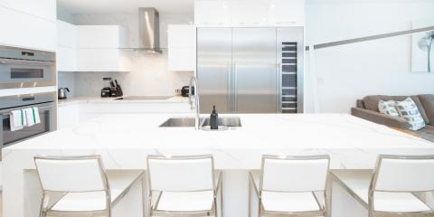 The image features a modern kitchen with a clean, minimalist design