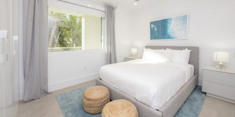 The image shows a contemporary bedroom with a clean and modern design