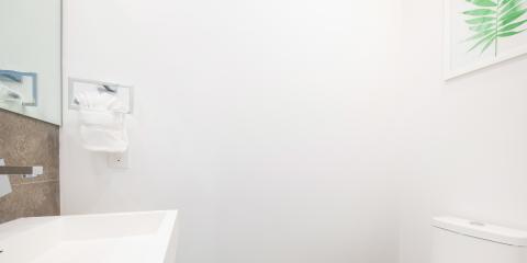 The image shows a modern and clean bathroom corner