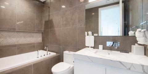 The image shows a modern bathroom interior featuring a combination of neutral color tones